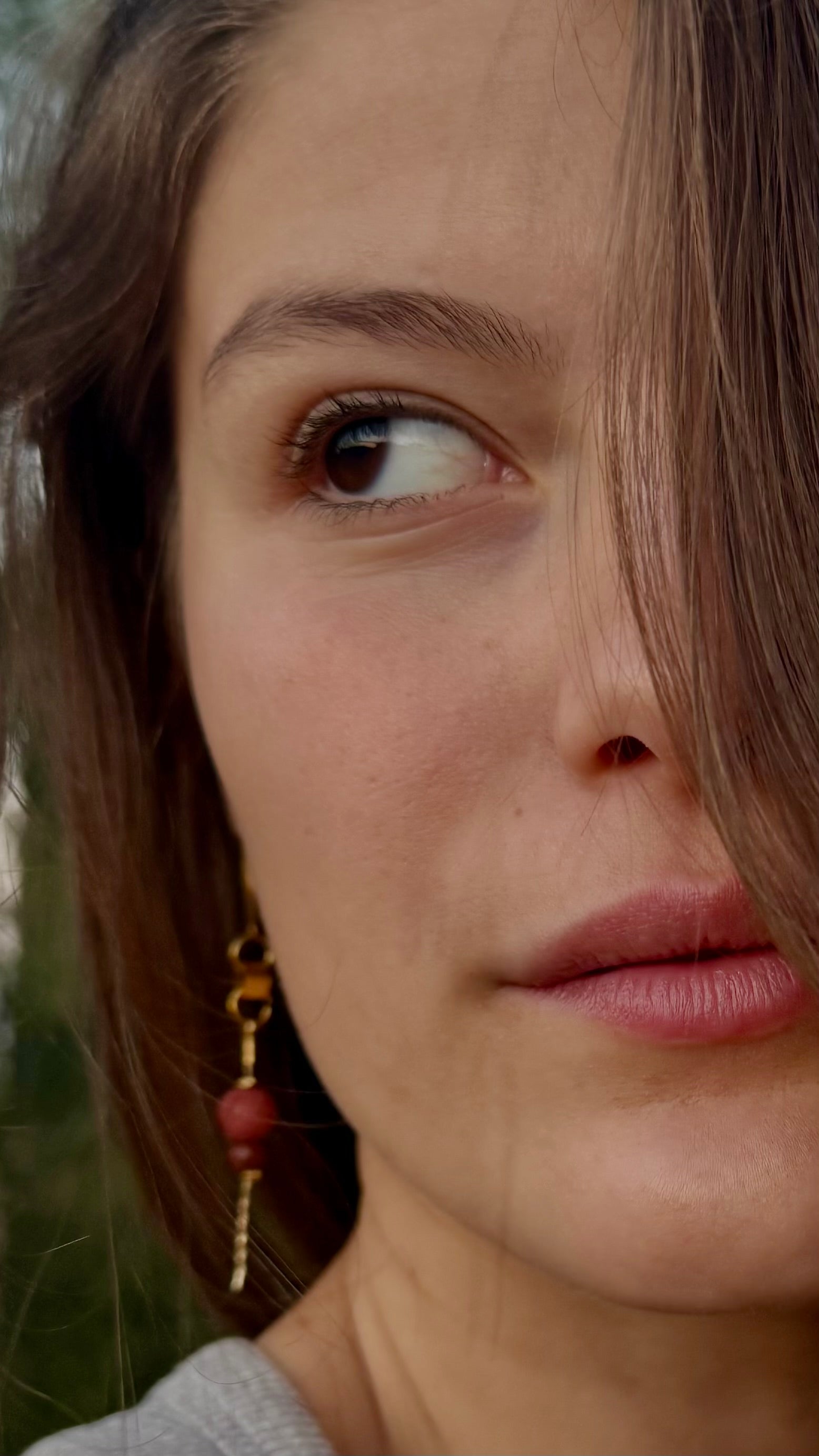 Close-up of a woman's face with a blurred background